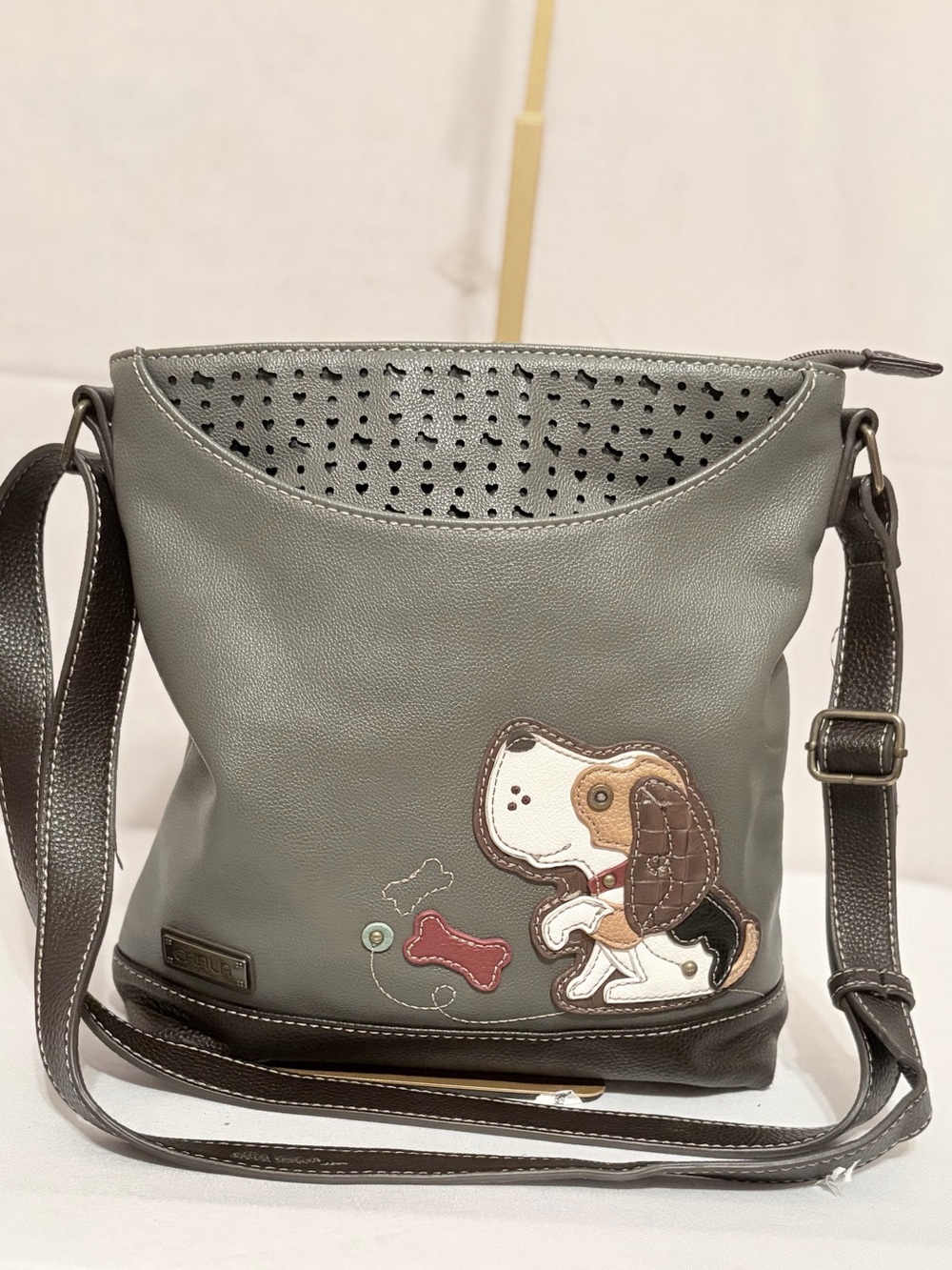 Gray Chala Sweet Messenger bag with a charming, detailed stitched puppy appliqué